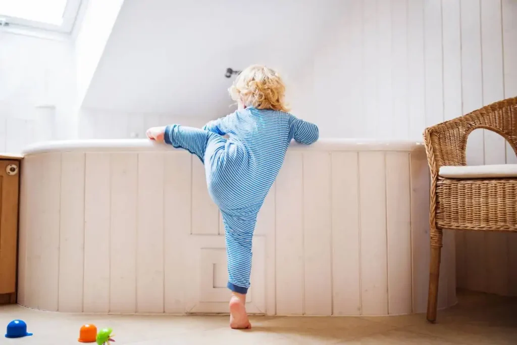Autistic Child Climbing On Furniture